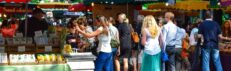 Lively scene at Borough Market in London, filled with people shopping and enjoying the atmosphere.